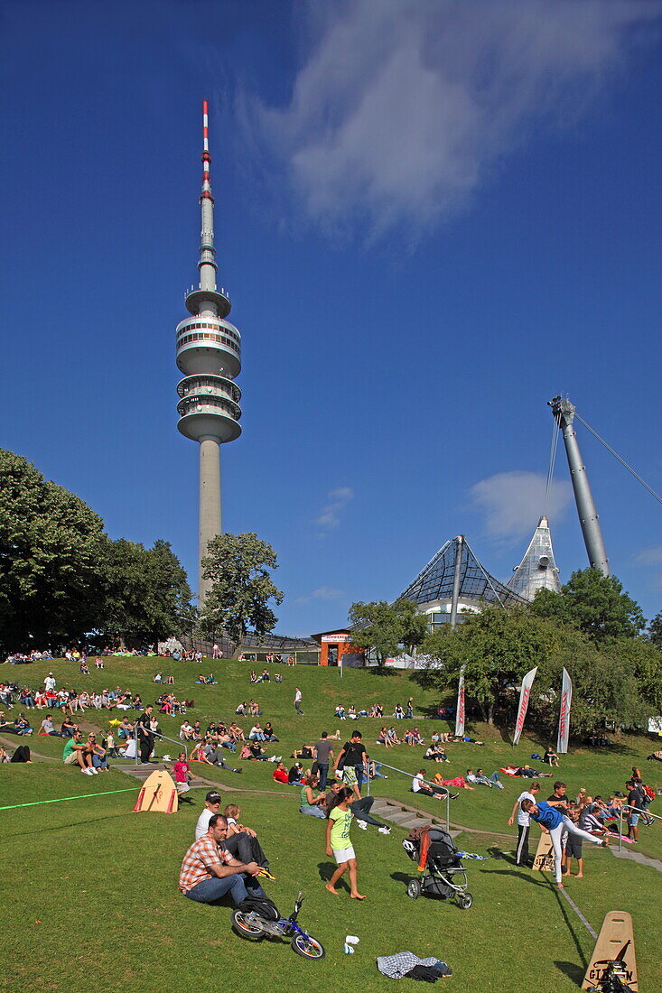 Olympipark, in the background the Olympic Tower, Munich, Upper Bavaria, Bavaria, Germany