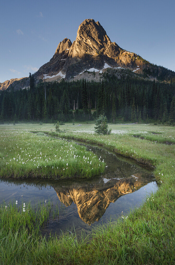 Liberty Bell Mountain reflected in waters of State Creek, Washington State Pass meadows, North Cascades, Washington State