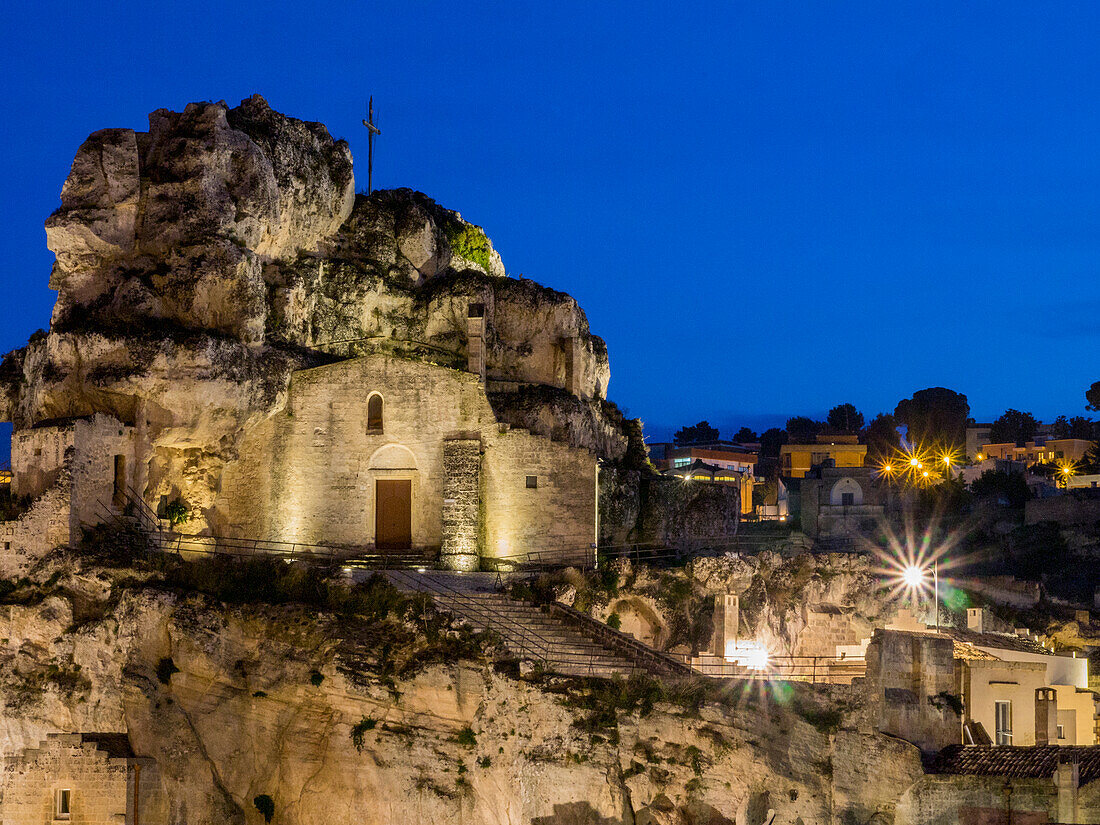 The Roman Catholic church of Santa Maria de Idris, cut into the rock in Matera at night.