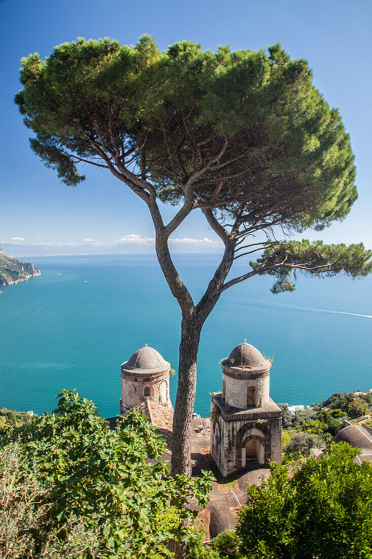 Italy, Campania, Ravello. View of the Amalfi Coast and the towers of Villa Rufolo in the hilltop town of Ravello.