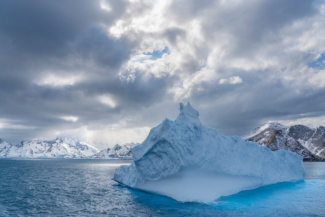 Antarctica, South Georgia Island. Landscape with iceberg and mountains