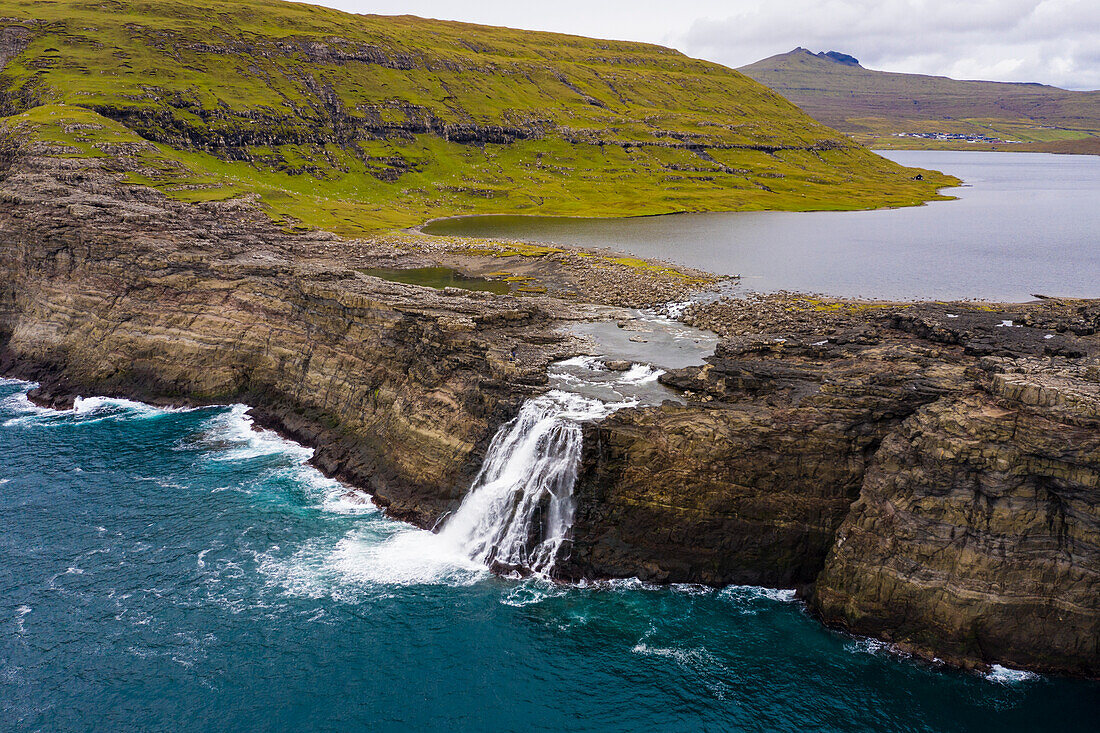 Europe, Faroe Islands. Aerial view Aerial view of Bosdalafossur, a waterfall draining the lake Sorvagsvatn on the island of Vagar.