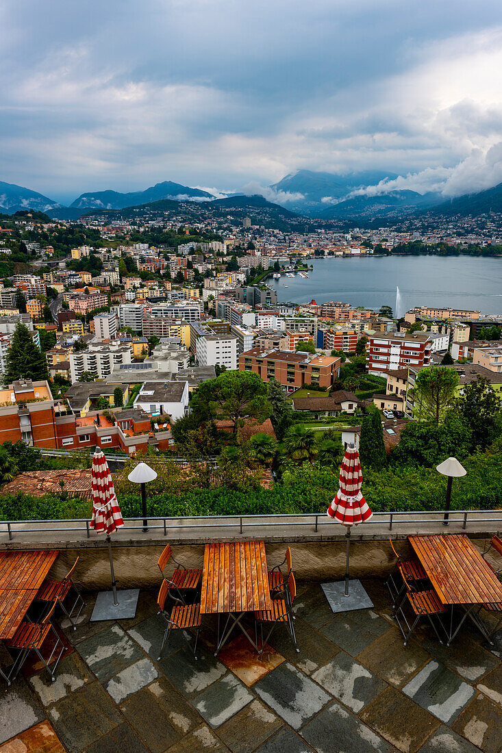 Terrace with Cityscape and Mountain and Lake Lugano in a Cloudy Day in Ticino, Switzerland.