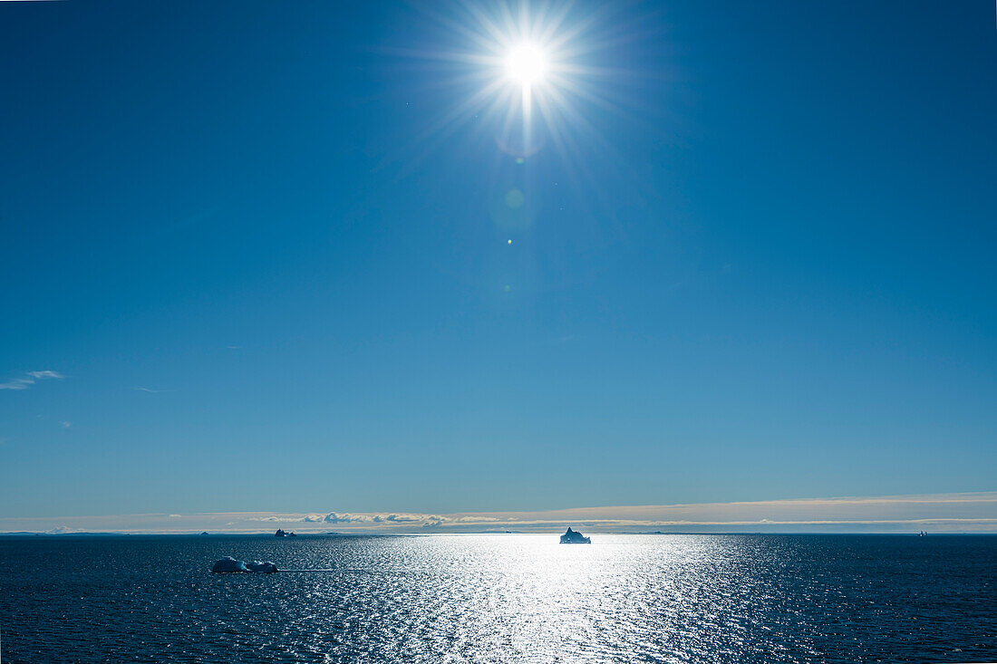 Backlit icebergs in Disko Bay, Baffin Bay, Ilulissat, Greenland