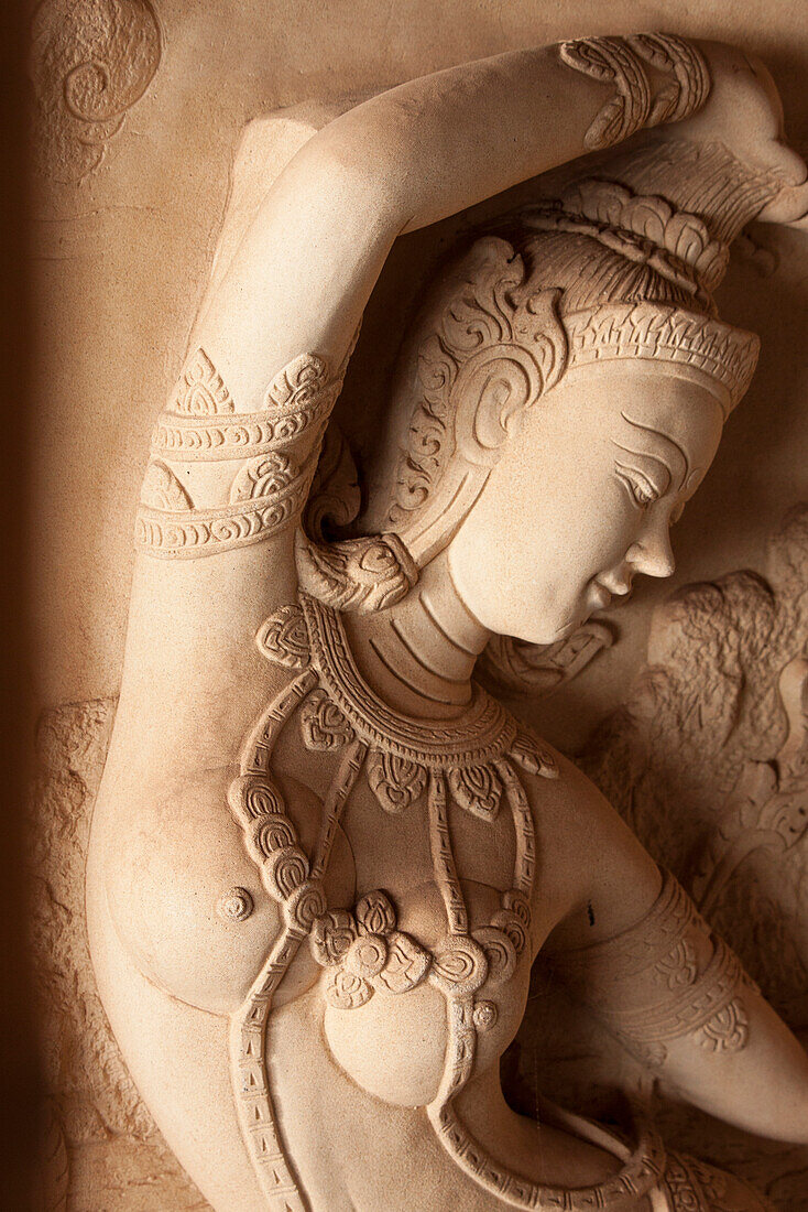 Thailand, Ko Samui. Carved stone relief of a Hindu deity.