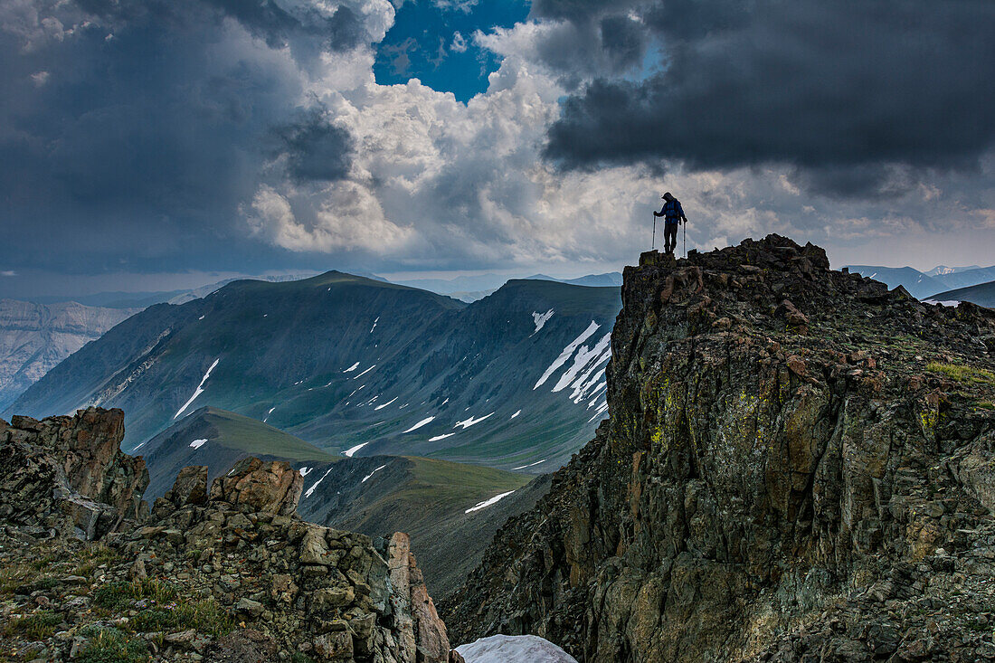 Male climber on ridge, Absaroka Mountains near Cody and Meeteetse, Wyoming, USA, Washakie Wilderness.