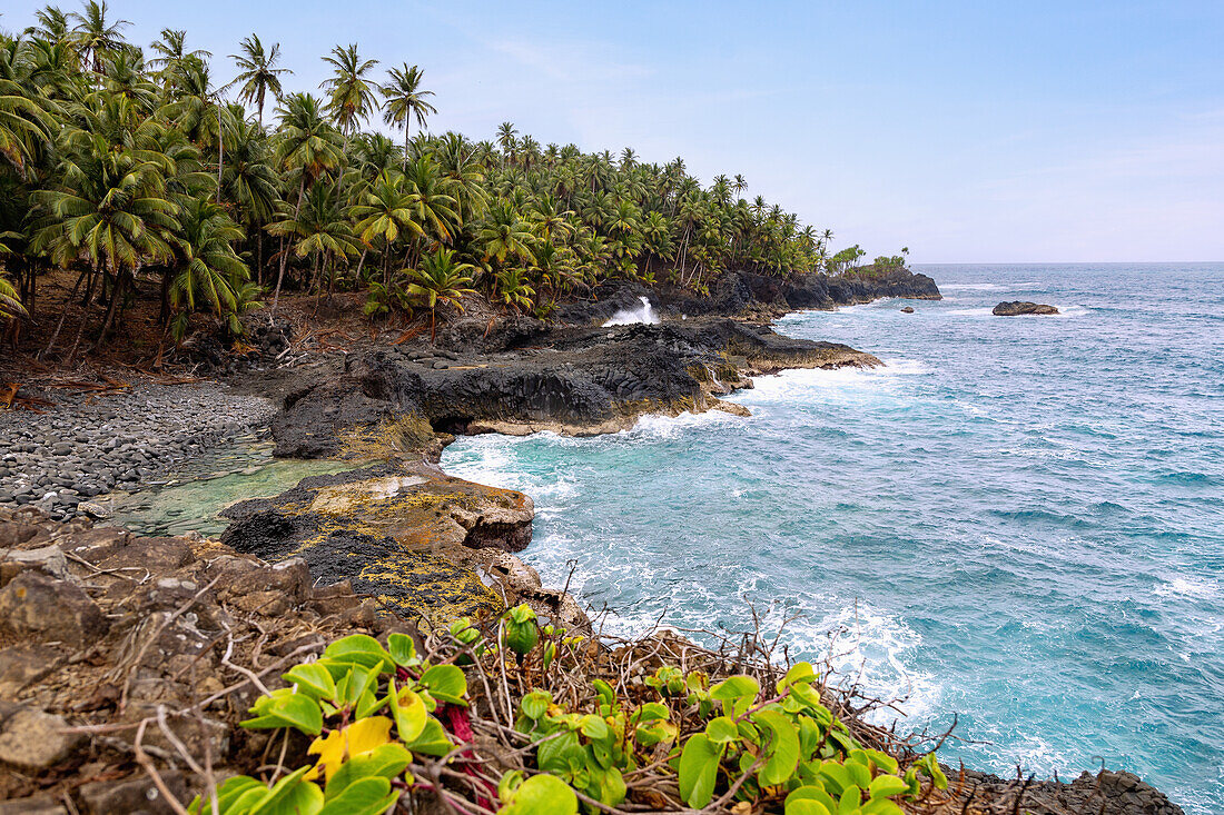 Basalt coast at Praia Piscina in the south of the island of São Tomé in West Africa