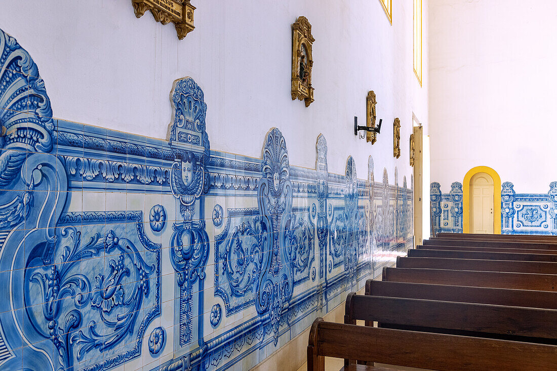 Interior of Nossa Senhora da Graça Cathedral with blue and white azuleijo frieze and yellow door in Sao Tome on the island of Sao Tome in West Africa