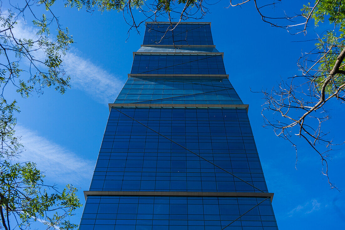 Glass skyscraper in Tbilisi's downtown on the blue sky background