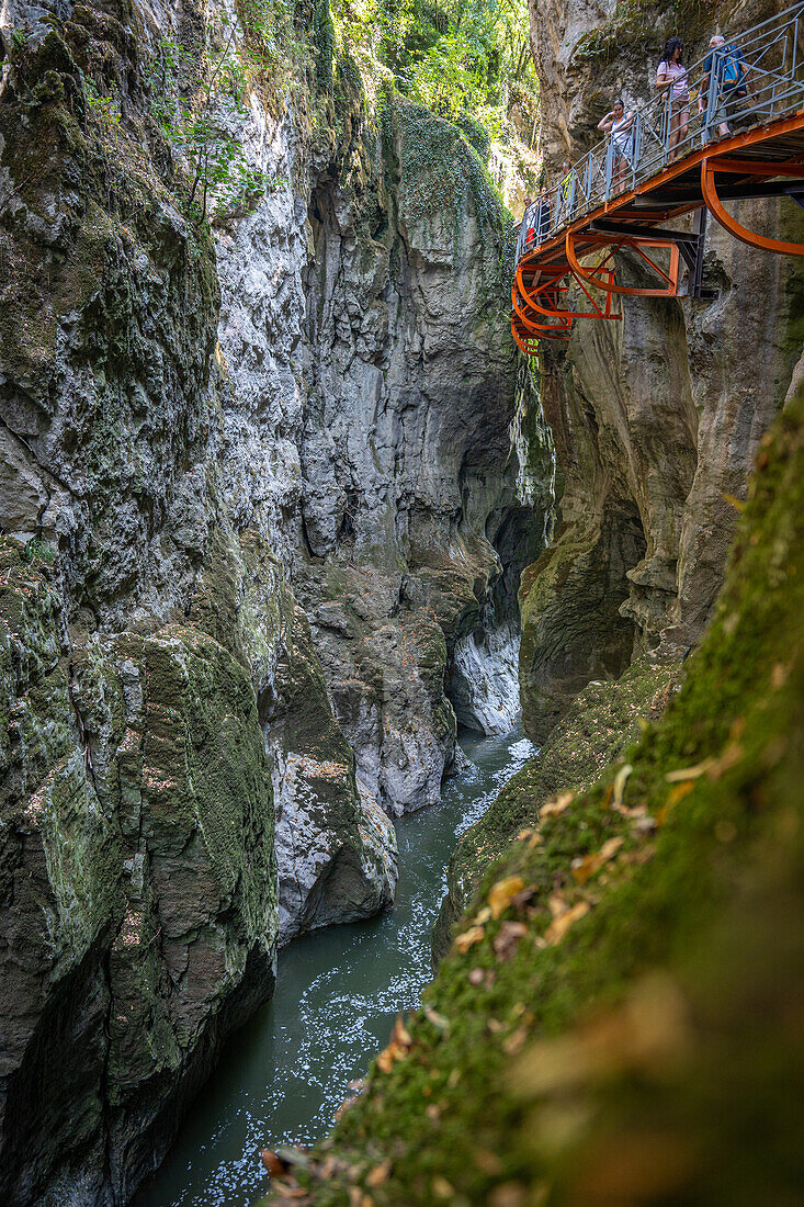 Gorge du Fier with people walking on a balcony-like plank path, Gorge du Fier, Annecy, Haute-Savoie, Auvergne-Rhône-Alpes, France