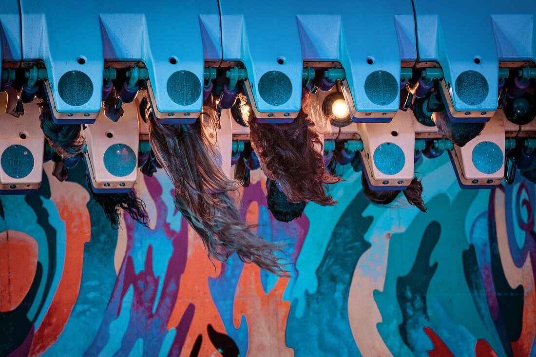 Flying hair at a ride at the Oktoberfest in Munich, Muenchen, Bavaria, Germany, Europe