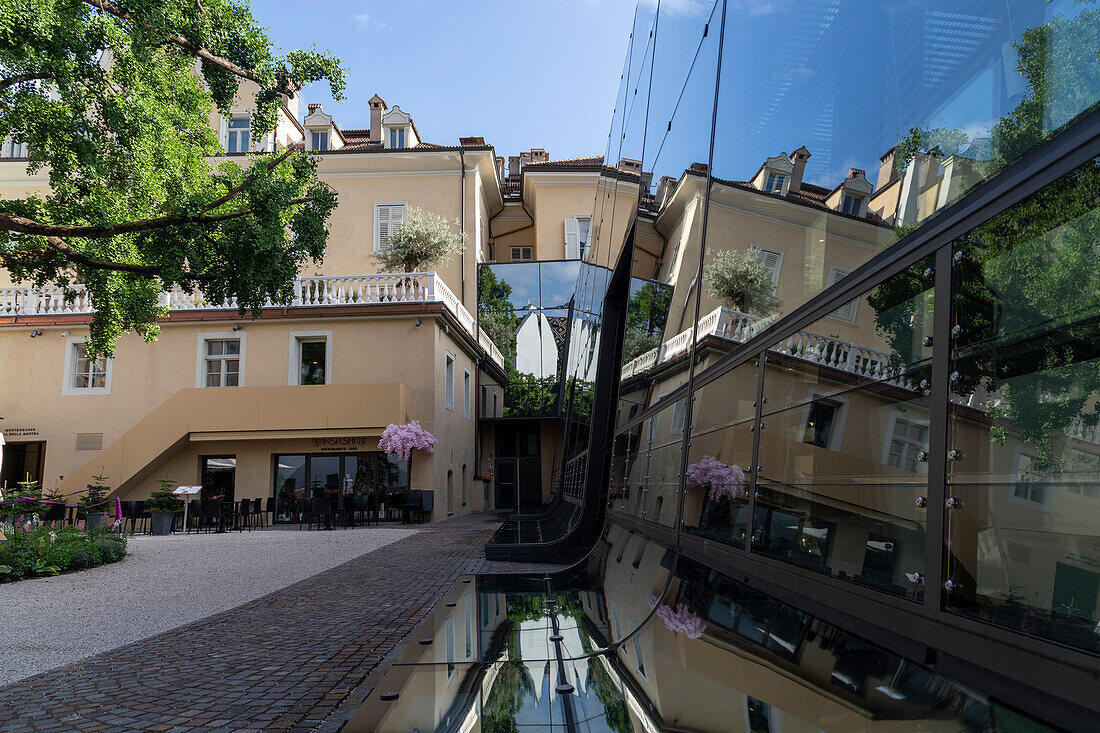 Reflections of buildings, Piazza Walther, Bolzano, South Tyrol, Italy