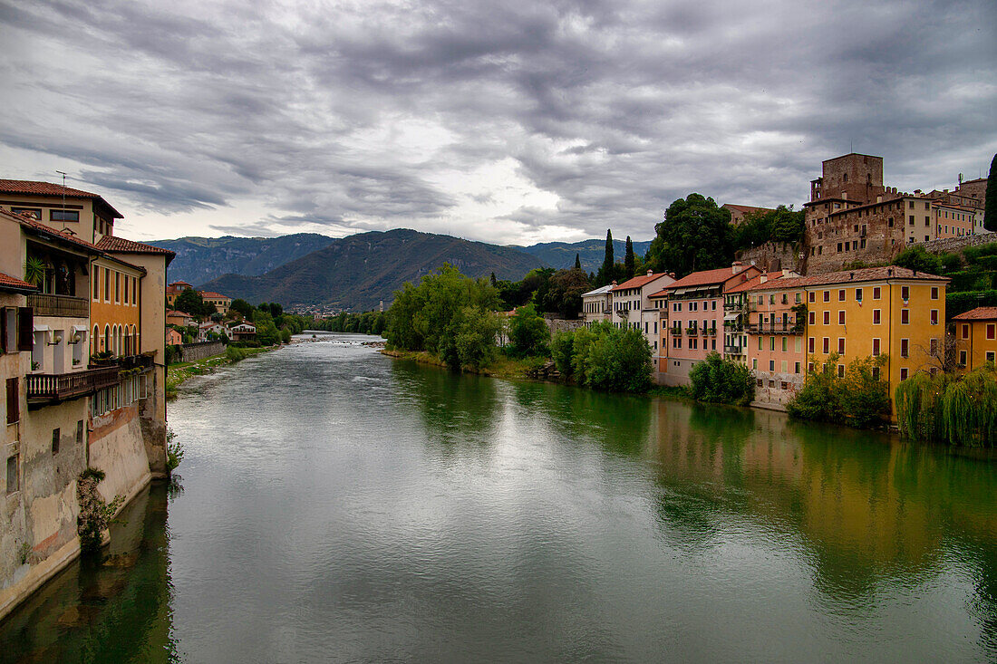 Panorama of Bassano del Grappa with the Brenta river under a cloudy sky, Veneto, Italy