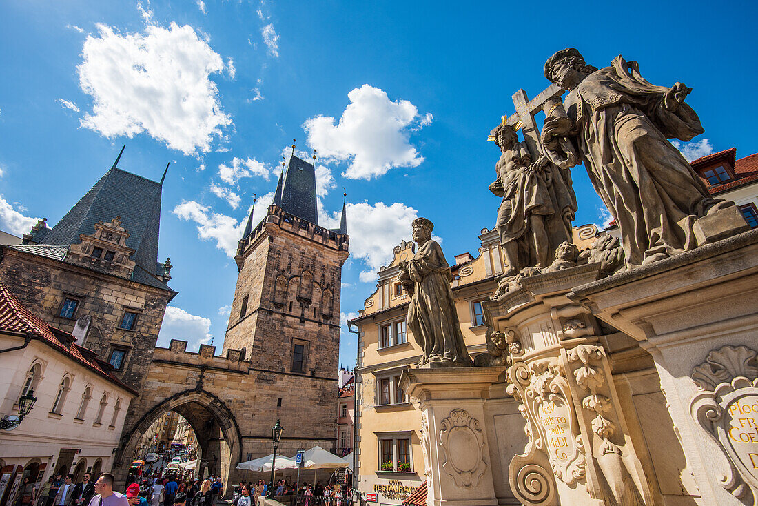 Charles Bridge with the bridge towers in Prague's Lesser Quarter and sculptural group depicting Saints Salvator and Cosmas and Damian, Prague, Czech Republic