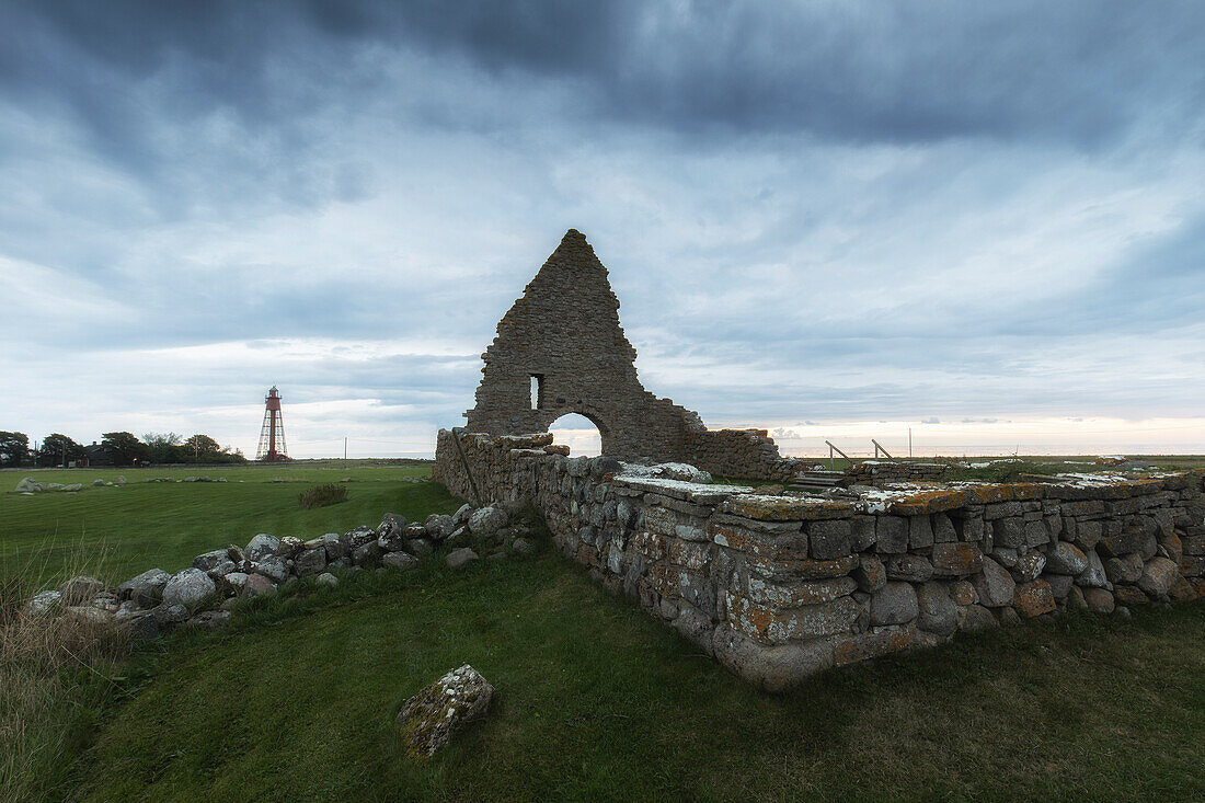 Saint Brita's chapel ruins and Kappelludden's lighthouse. Light dawn. Oland, Sweden.