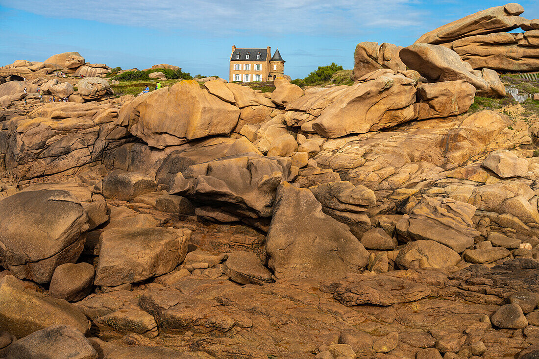 The rocks of the pink granite coast Côte de Granit Rose and Maison Gustave Eiffel at Ploumanac'h, Perros-Guirec, Brittany, France