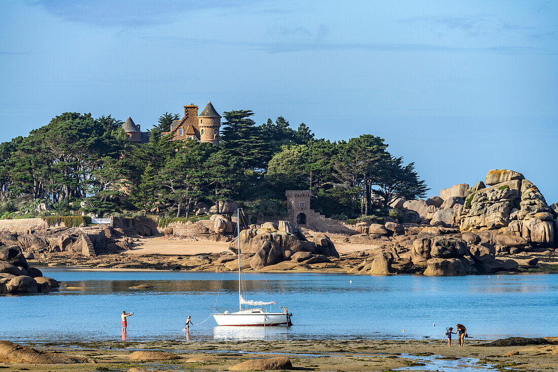 The rocks of the pink granite coast Côte de Granit Rose at Ploumanac'h and the Costaérès Castle, Perros-Guirec, Brittany, France