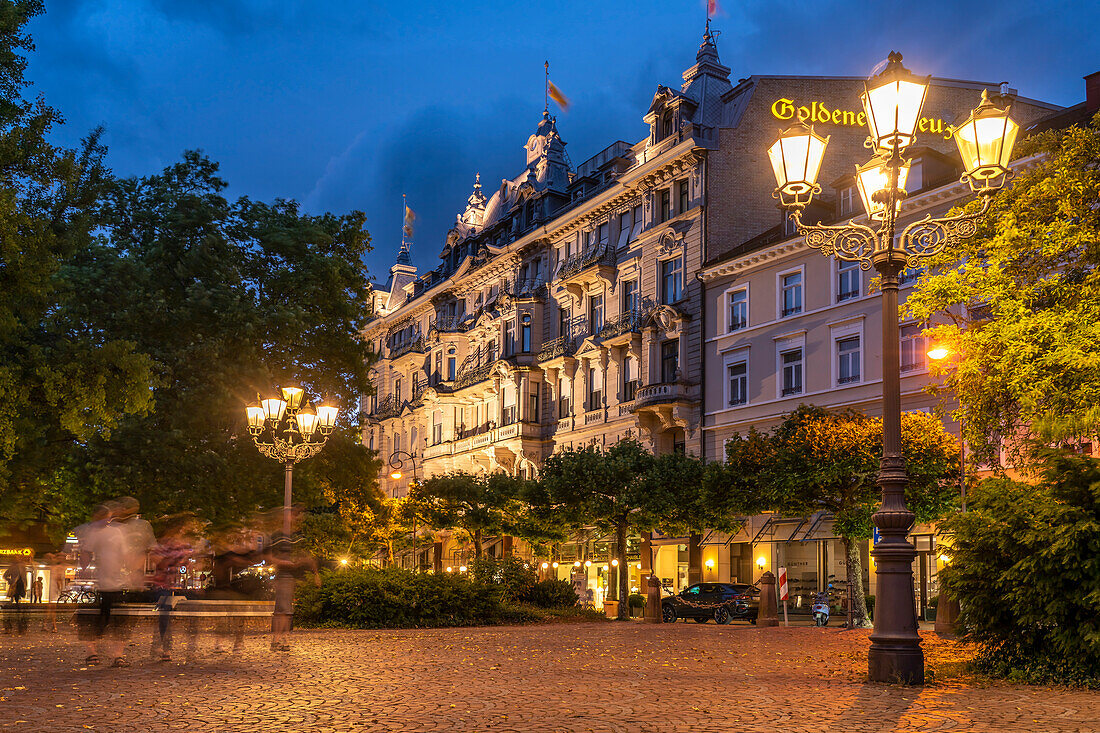 The historic residential and commercial building Goldenes Kreuz at dusk Baden-Baden, Baden-Württemberg, Germany