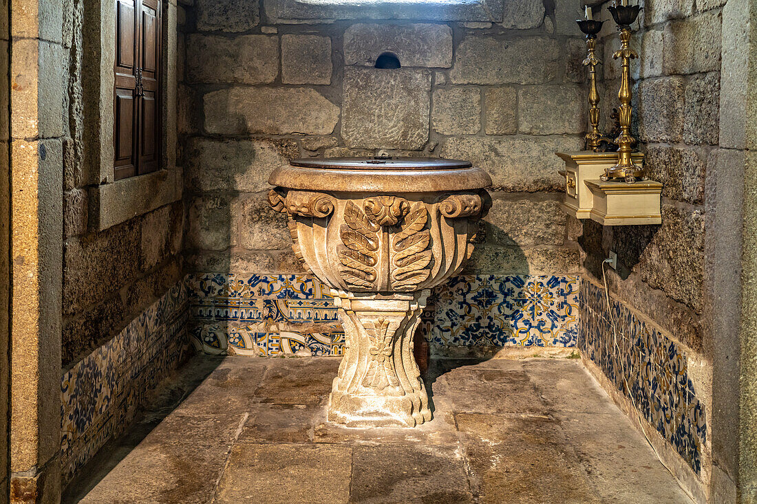 Baptismal font in the Church of Nossa Senhora da Oliveira, Guimaraes, Portugal, Europe