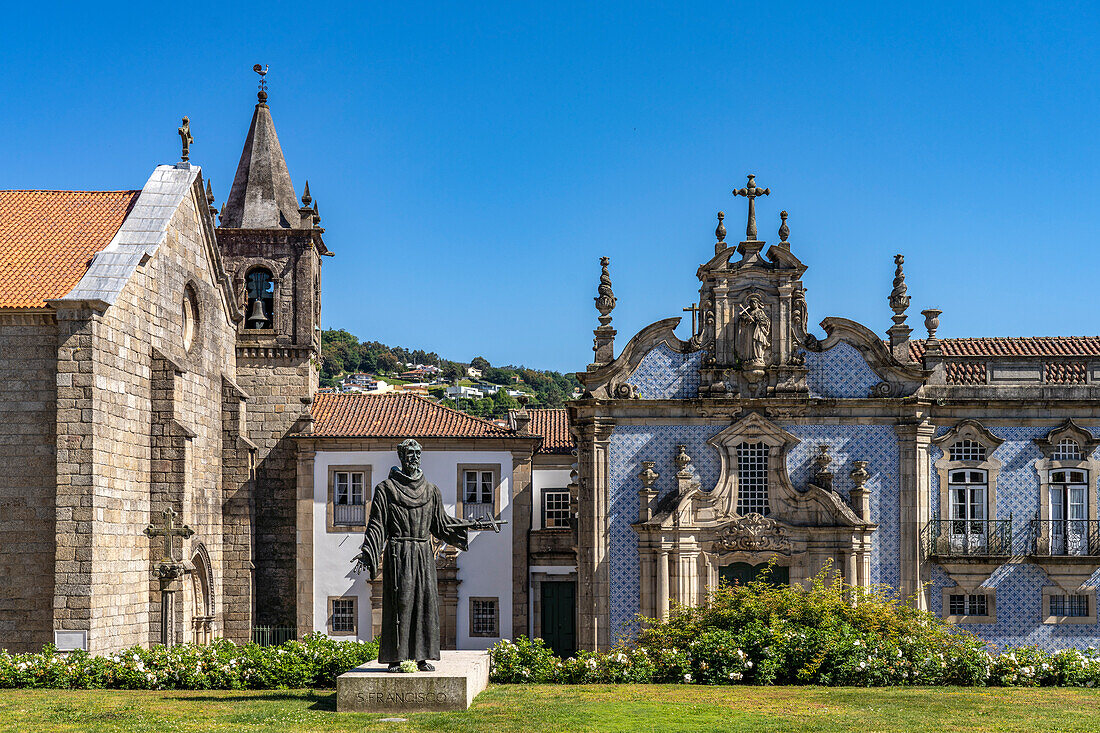 Statue of Saint Francis in front of the Igreja de Sao Francisco church, Guimaraes, Portugal, Europe