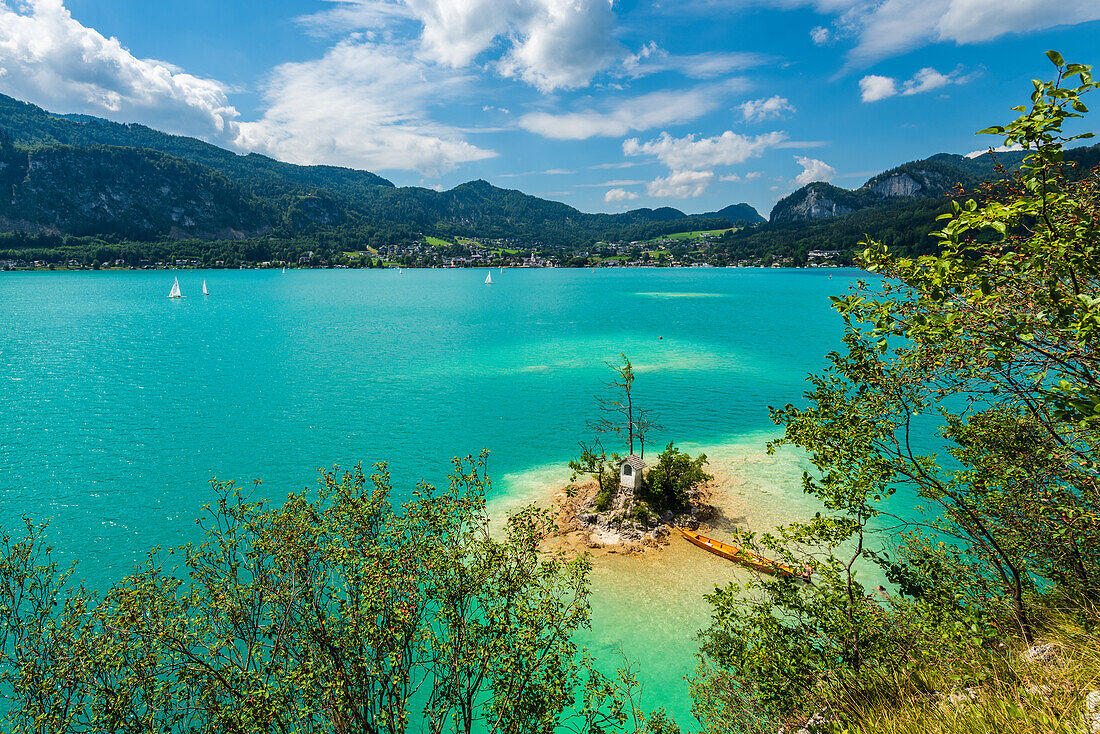 Metzgerinsel with the Ochsenkreuz wayside shrine in Lake Wolfgang, Salzburg, Austria