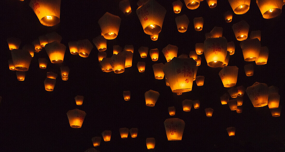 Night view of Sky Lanterns in the air during Chinese Lantern Festival, Shifen, Taiwan