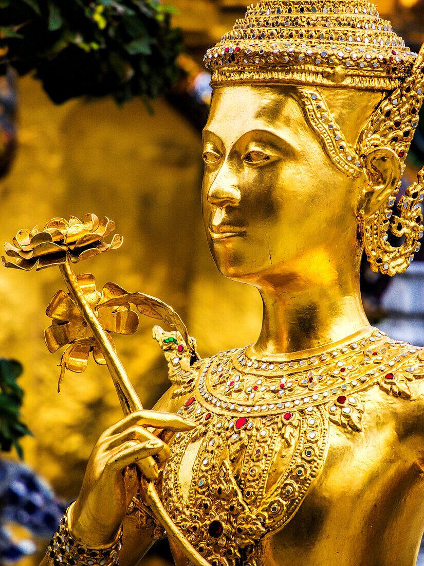 Thailand, Bangkok, Golden Kinnara statue at Emerald Buddha Temple (Wat Phra Kaew) in Grand Palace