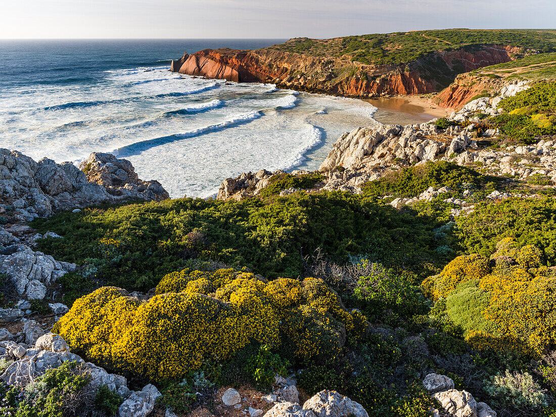 Beach and cliffs at Praia do Telheiro at the Costa Vicentina. The coast of the Algarve during spring. Portugal