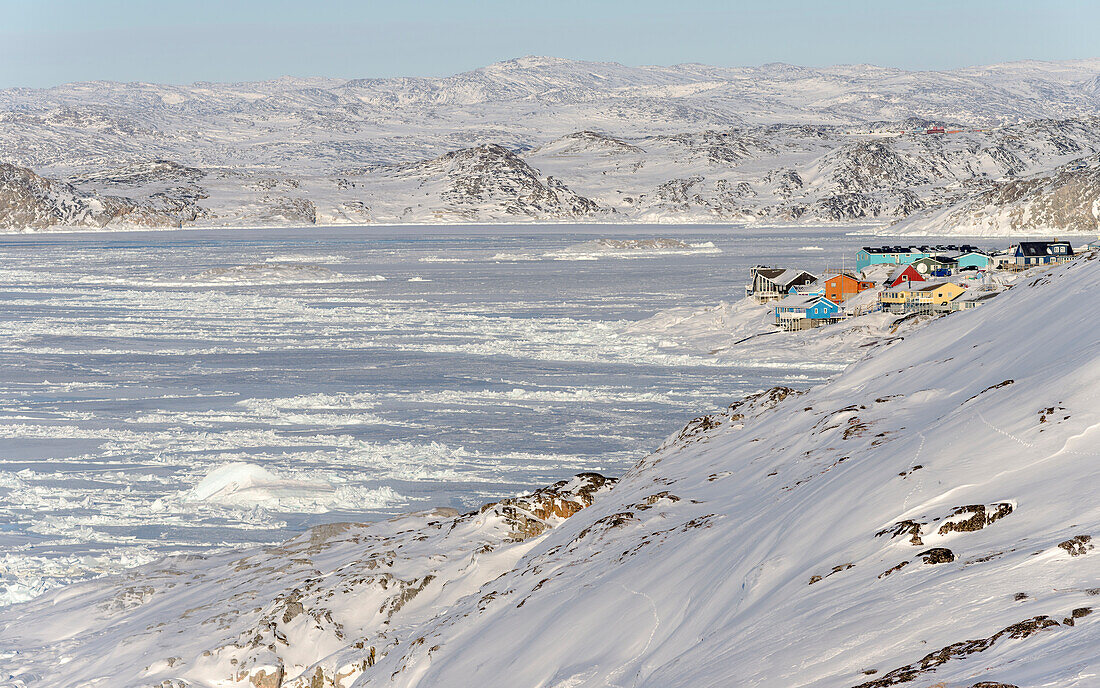 Winter in Ilulissat on the shore of Disko Bay. Greenland, Denmark