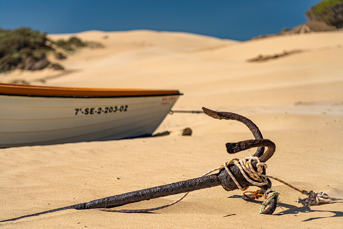 Rusty anchor on Bolonia beach, Tarifa, Costa de la Luz, Andalucia, Spain