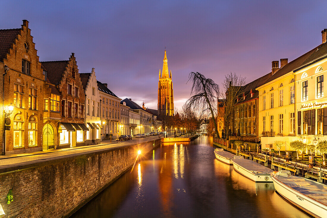Canal and Church of Our Lady at dusk, Bruges, Belgium, Europe