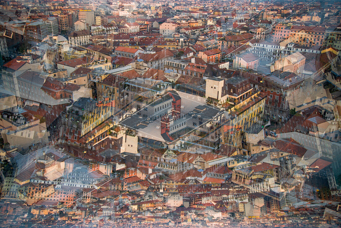Double exposure photograph of the rooftops of Milan in the setting sun, Italy.