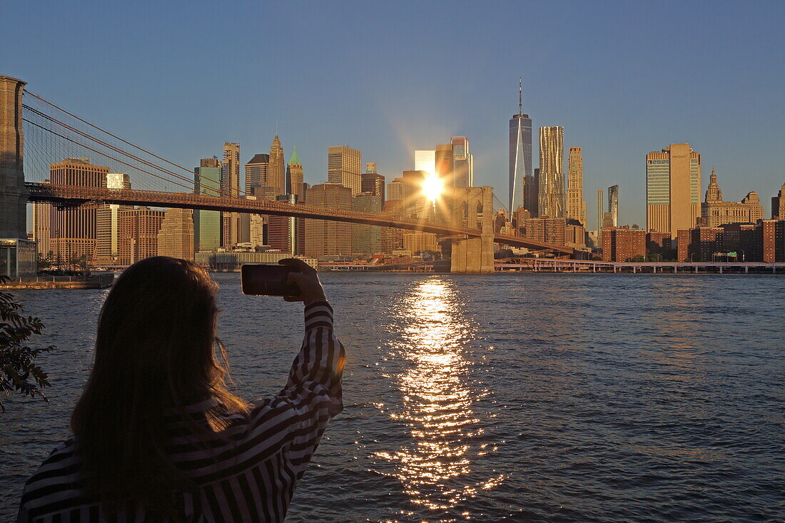 View from Bridge Park in Brooklyn of the Brooklyn Bridge and the Financial District of Lower Manhattan, New York, New York, USA