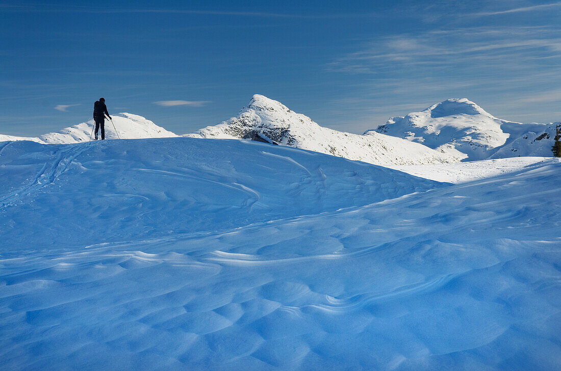 Skier on the snow, backcountry skiing, in deep snow.