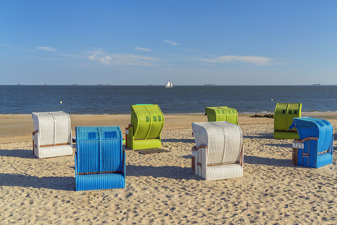 Beach chairs on the beach with a view to Hallig Langeness, Wyk, Foehr Island, Schleswig-Holstein, Germany