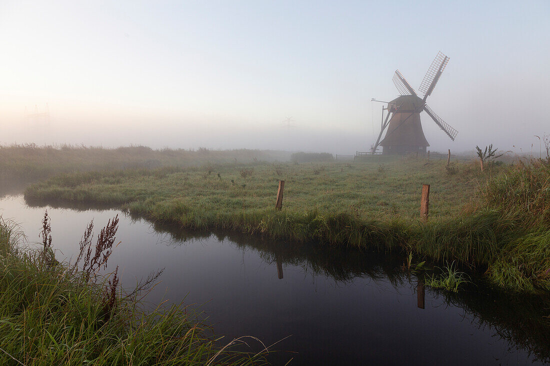 windmill, water mill. Neustadt-Gödens, Friesland, Lower Saxony, Germany. small canal.