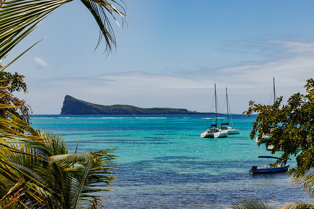 The sea with boats at Bain Boeuf Public Beach, Mauritius, Indian Ocean