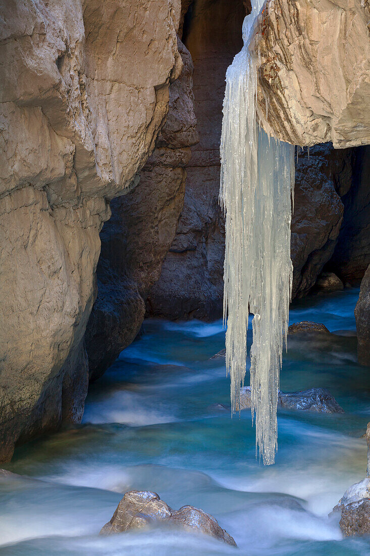 Wintry conditions with a large icicle in the Partnach Gorge near Garmisch-Partenkirchen.