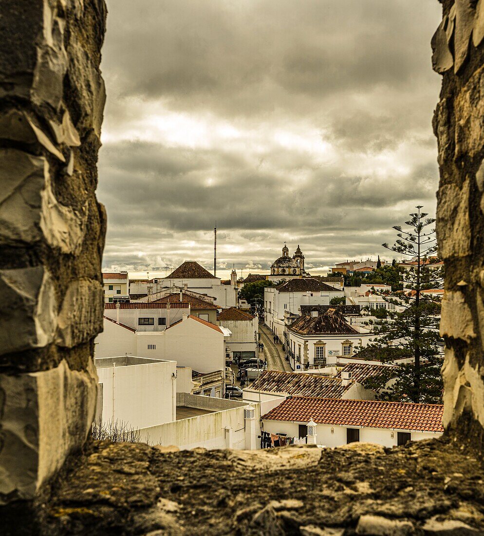 View from the Castelo da Tavira over the roofs of the old town to the Igreja de Sao Francisco, Tavira, Algarve, Portugal