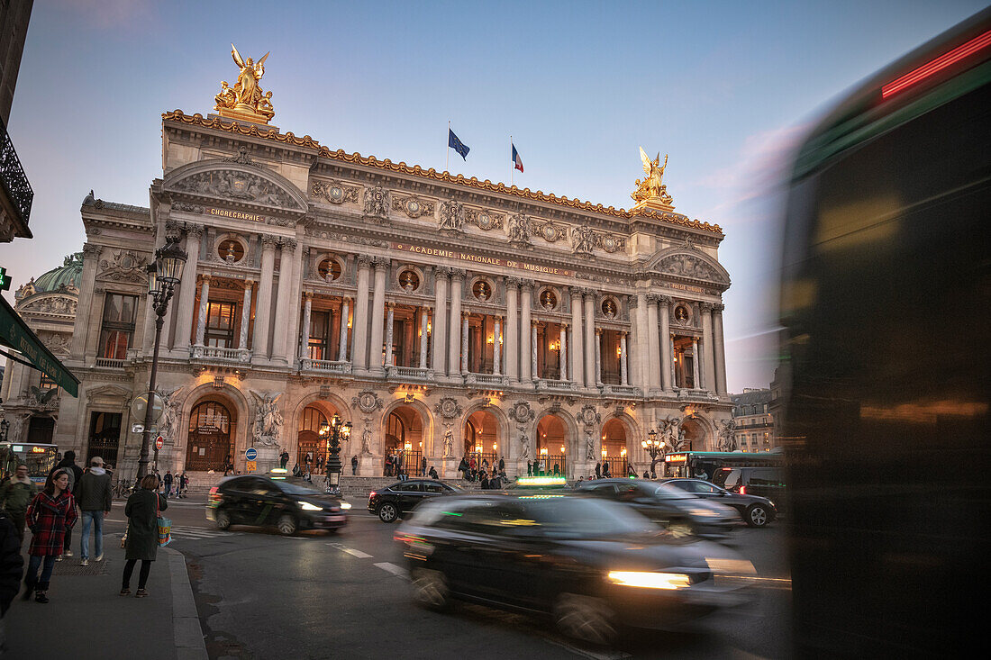 Rush hour traffic in front of Opera Garnier, Paris capital, Ile-de-France, France