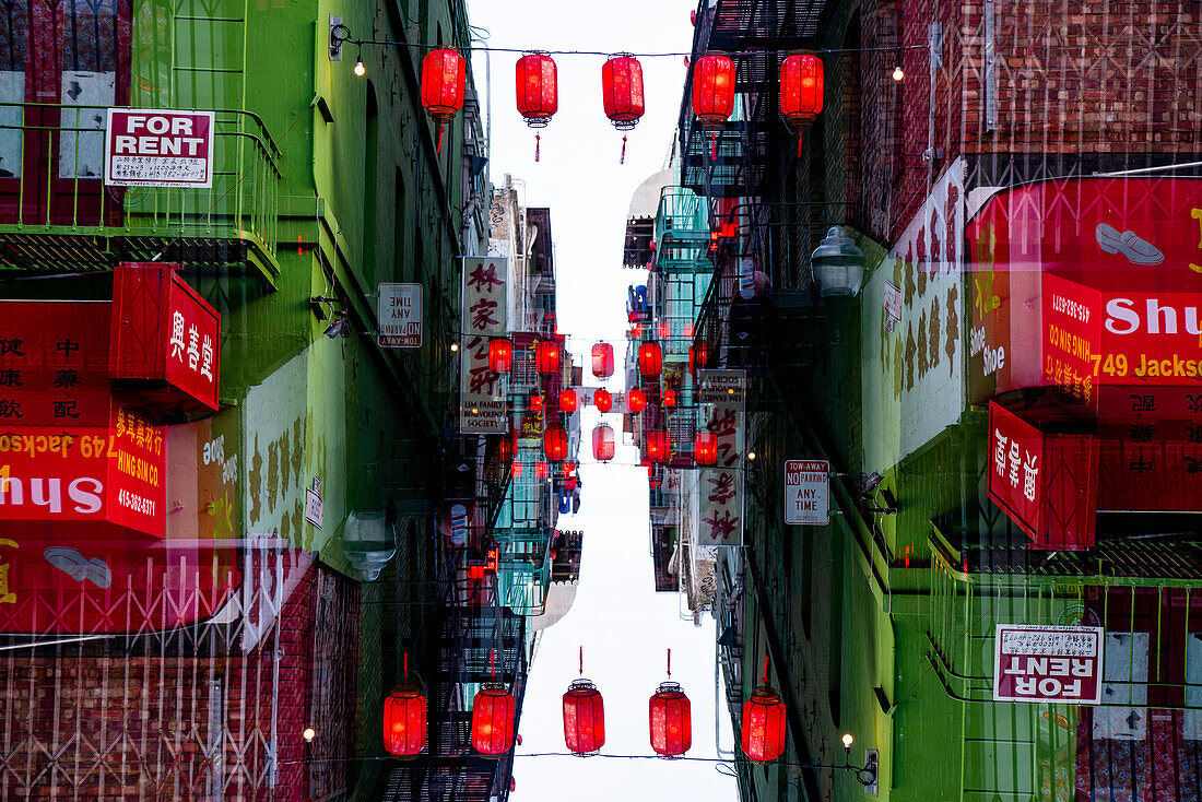 Double exposure of Ross  Alley sided with buildings featuring Chinese lettering and Chinese Lanterns on Grant Avenue in Chinatown, San Francisco.