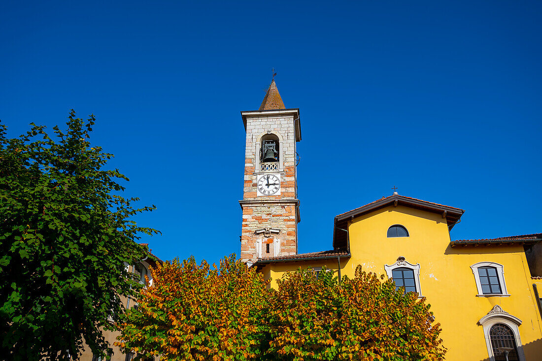Old House and Church Tower in a Sunny Day in Arzo, Ticino, Switzerland.