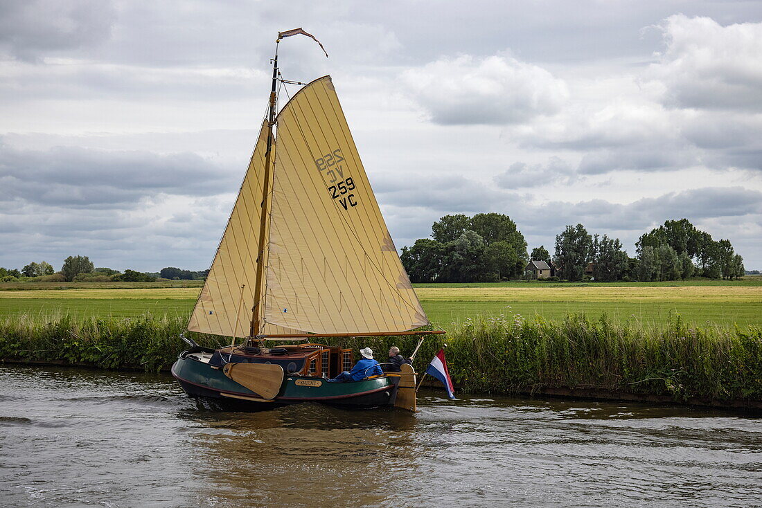 Sailing boat on Prinses Margarietkanaal, near Heeg, Friesland, The Netherlands, Europe
