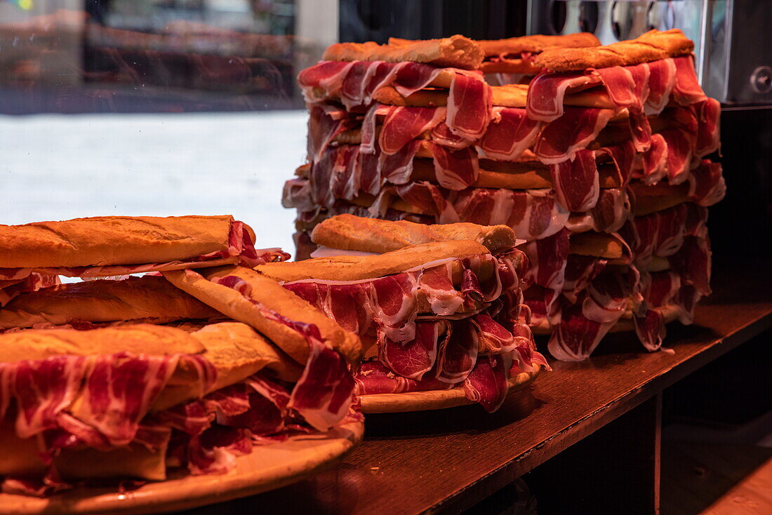 Delicious jamon bocadillos (ham sandwiches) for sale in delicatessen butcher shop, Salamanca, Castilla y Leon, Spain, Europe