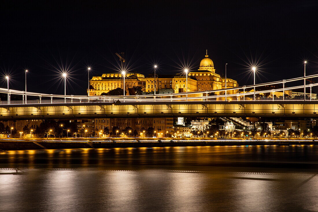 View from the deck of river cruise shipExcellence Empress (Mittelthurgau travel agency) to the Szechenyi Chain Bridge over the Danube and Buda Castle at night, Budapest, Pest, Hungary, Europe