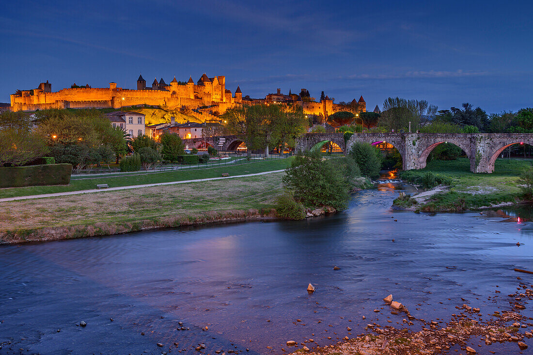 Illuminated Cite de Carcassonne fortress with Aude river in the foreground, Carcassonne, Canal du Midi, UNESCO World Heritage Canal du Midi, Occitania, France