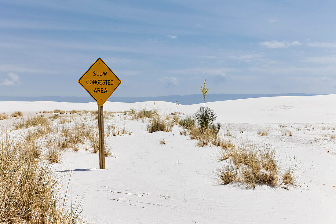 USA, New Mexico, White Sands, Warning sign on white sand desert