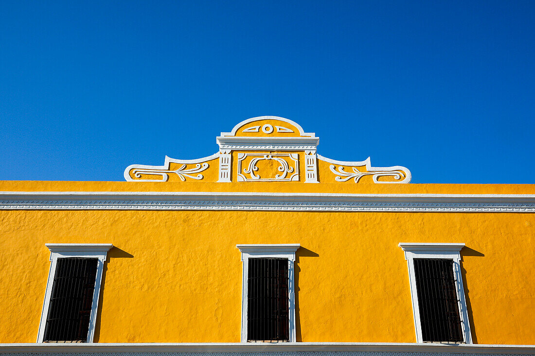 Mexico, Valladolid, Yellow building against blue sky