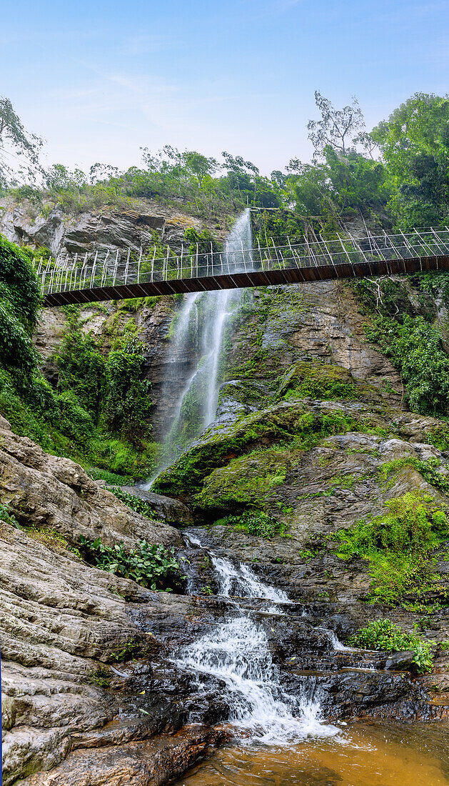 Ote Waterfall and suspension bridge in the Avatime Mountains landscape at Ho in the Volta Region of eastern Ghana in West Africa