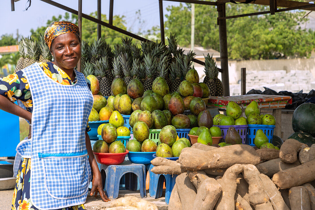 Street sales of mangoes, pineapples, avocados and yams in Winneba in the Central Region of western Ghana in West Africa